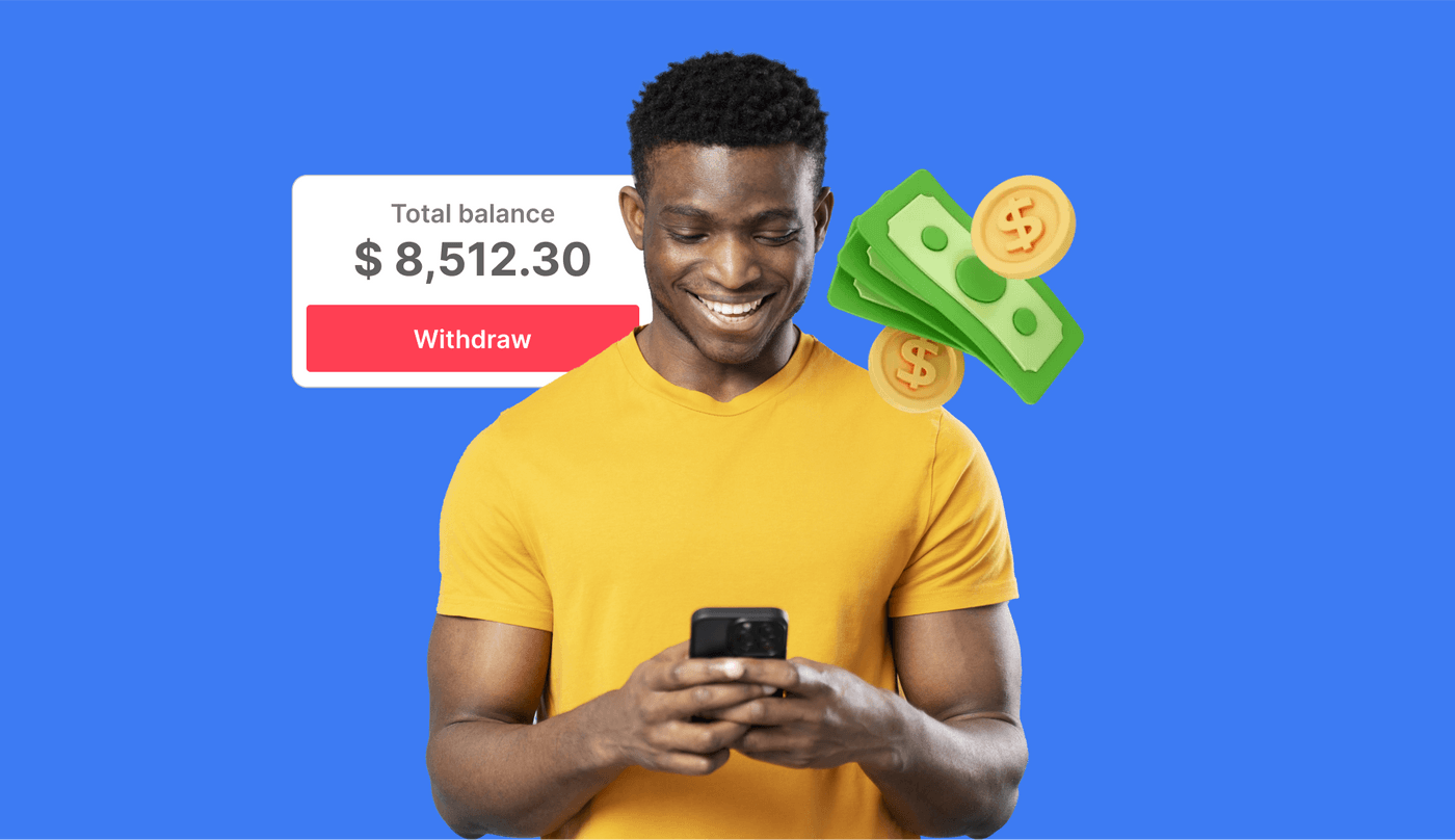 Man in yellow shirt smiling at phone with cash icons and balance showing $8,512.30.