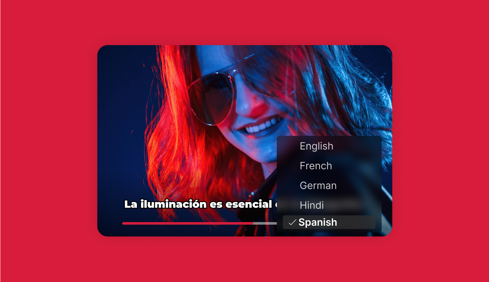 Red-haired woman, Spanish subtitles read 'La iluminación es esencial', language menu visible.